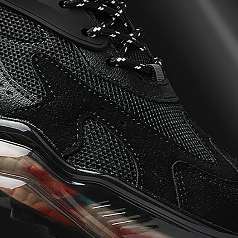 Close-up of luxury black breathable running sneakers featuring a stylish design and durable rubber sole.