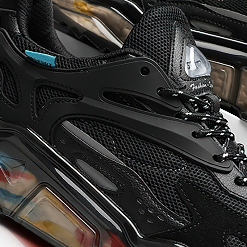 Close-up of luxury mesh breathable running sneakers showcasing stylish black design and rubber sole.
