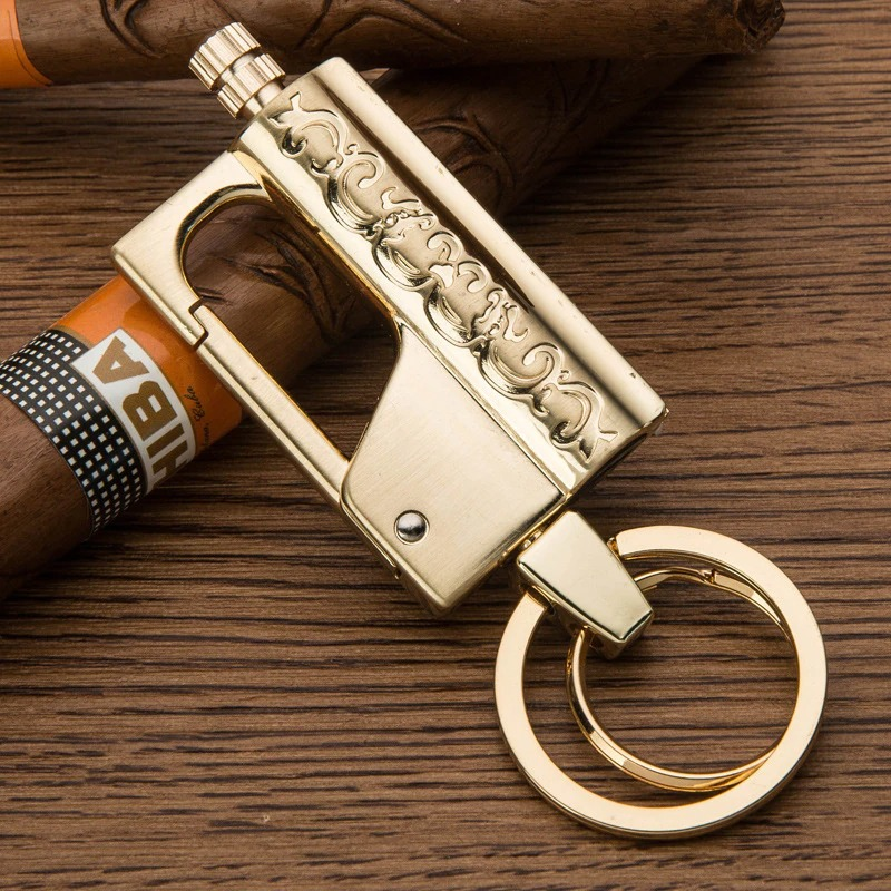 Elegant gold multifunction keychain lighter showcasing intricate design, perfect for casual style and convenience.