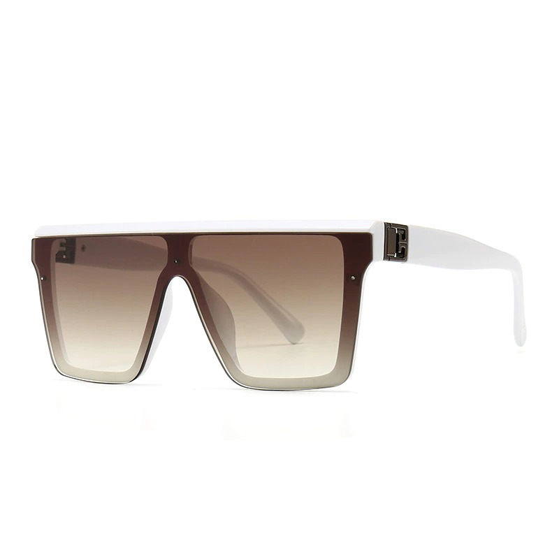 Luxury oversized square sunglasses with a white resin frame and gradient brown lenses. Vintage-inspired accessory for stylish looks.