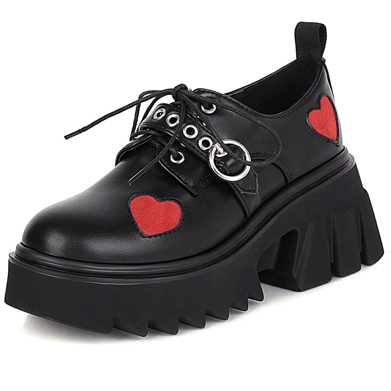 Luxury women's chunky black pumps with heart decorations, perfect for goth and punk styles.