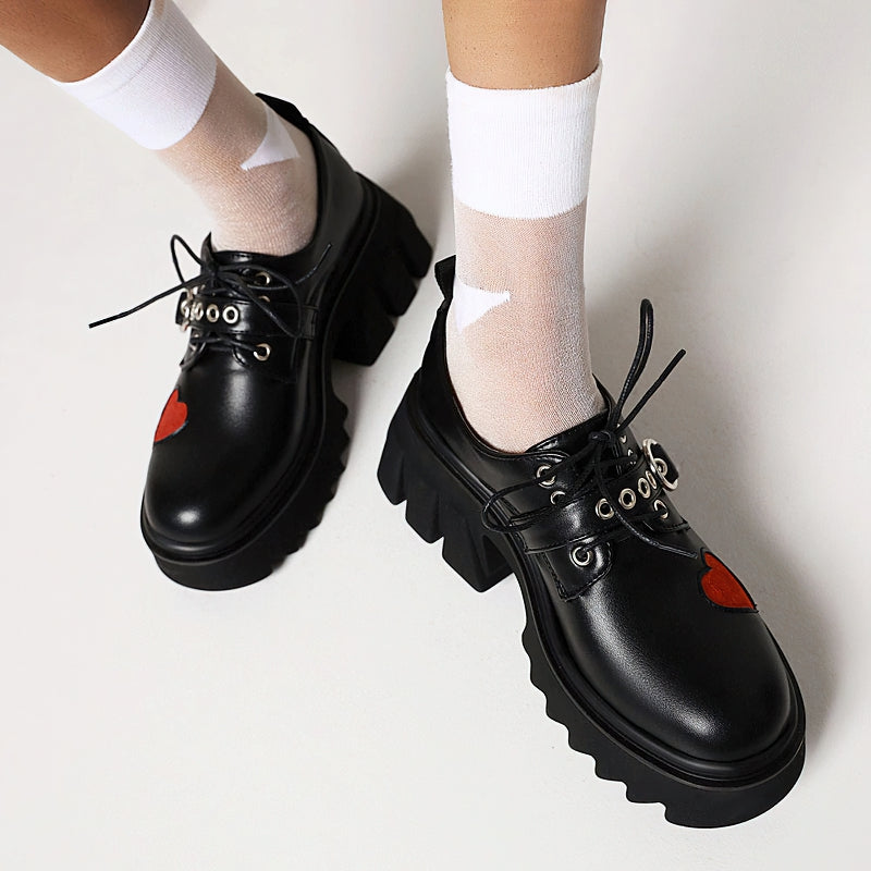 Stylish black chunky pumps with heart decoration, perfect for women's gothic fashion and alternative rock outfits.