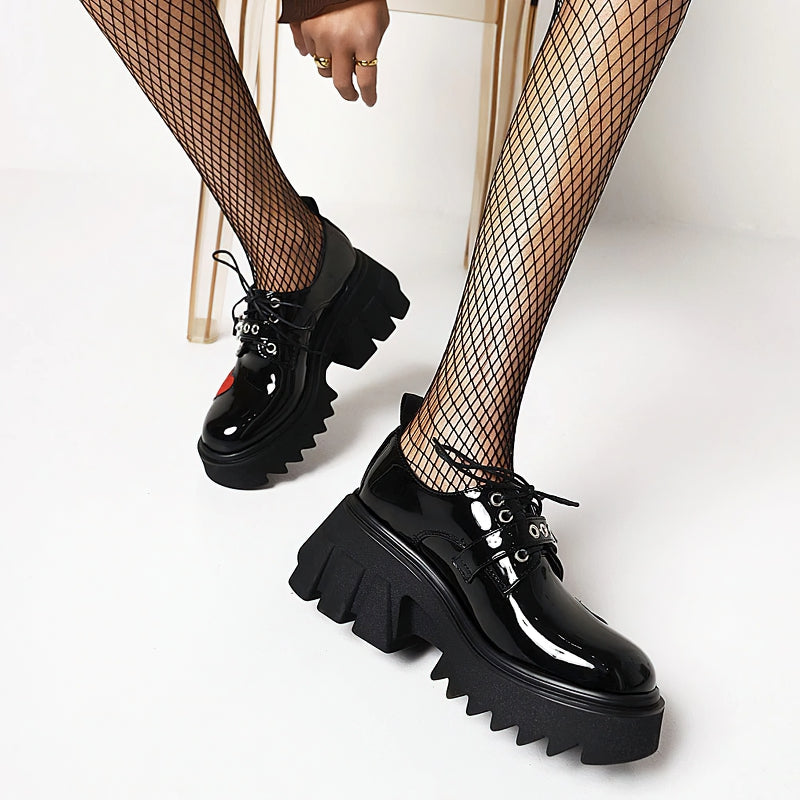 Women's chunky pumps in black with high heels and heart details, perfect for gothic and punk fashion.