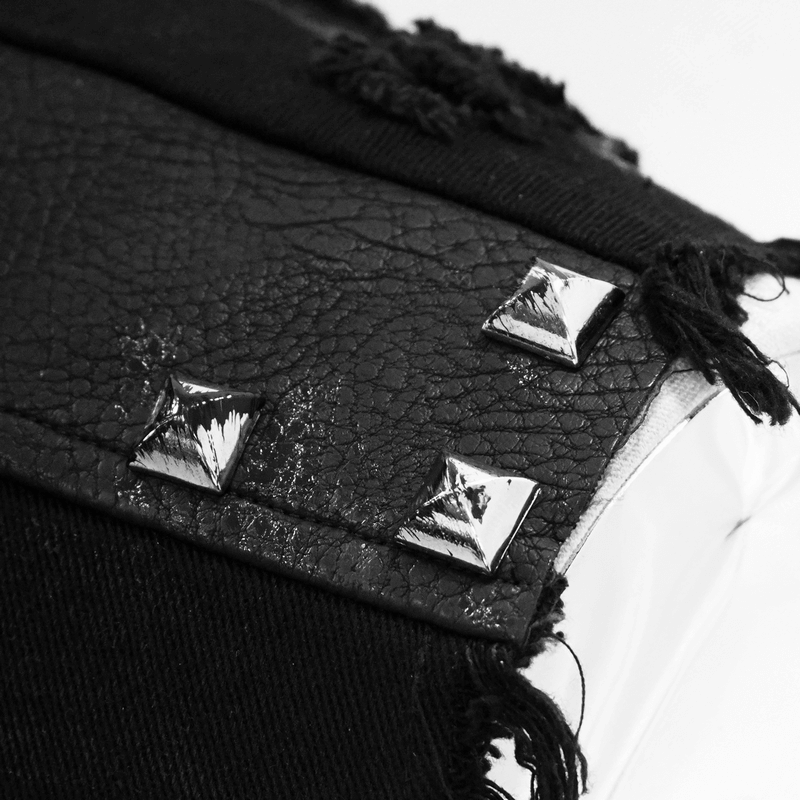 Close-up of silver rivets on a black steampunk-style waistcoat, highlighting stylish details.