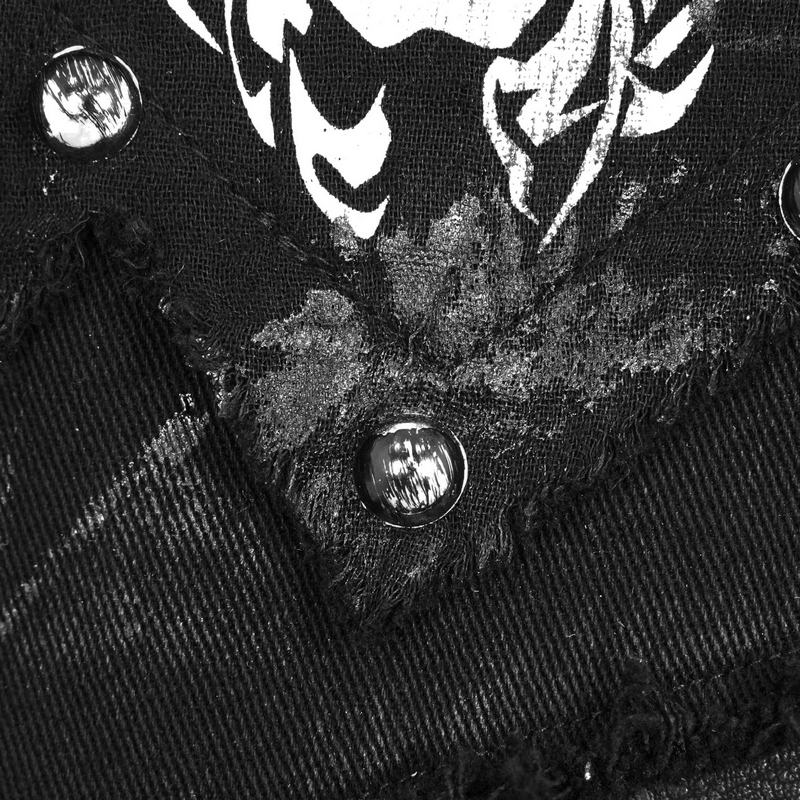 Close-up of black vest with silver rivets and skull print, showcasing modern steampunk fashion details.