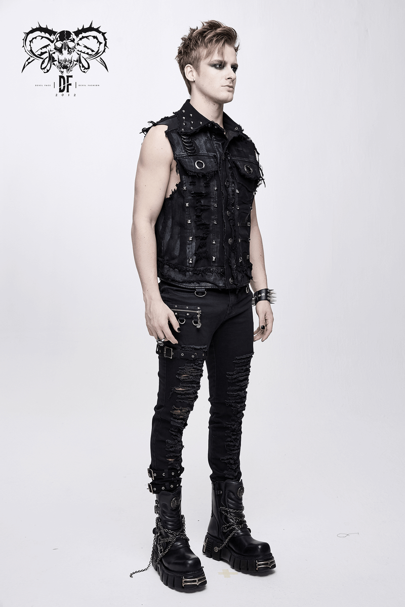 Stylish male model in a black steampunk vest with rivets, showcasing modern Gothic fashion.