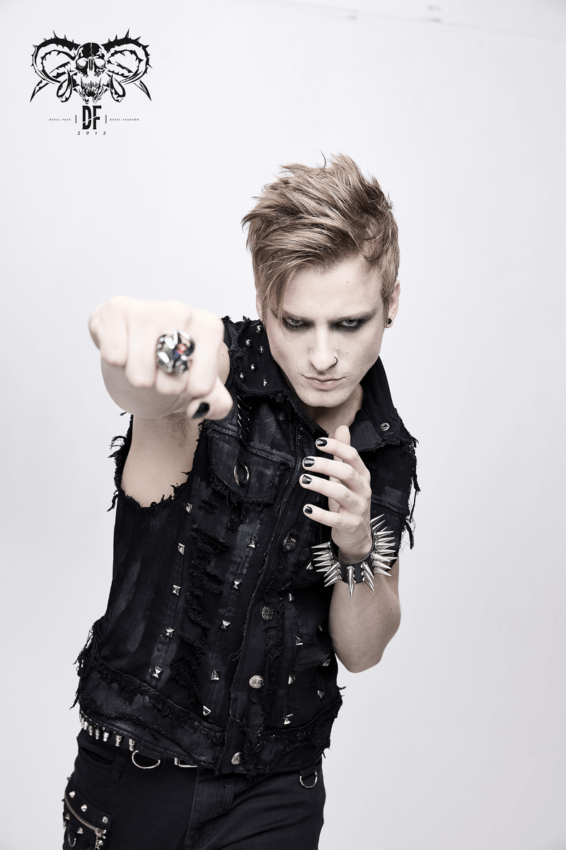 Model wearing a black steampunk waistcoat with silver rivets, showcasing edgy fashion style.