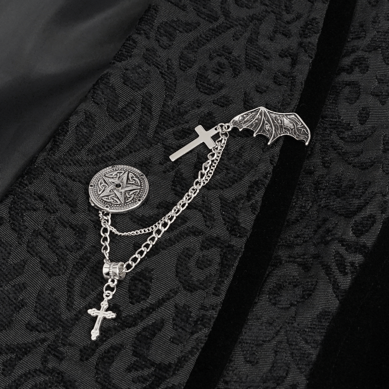 Gothic style waistcoat embellishment featuring silver cross and bat charms on a black jacquard fabric.