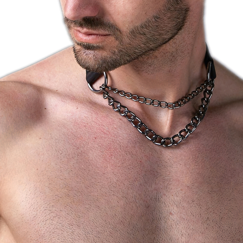 Close-up view of a male model wearing a punk-style bondage body harness with silver chains and PU leather accents.