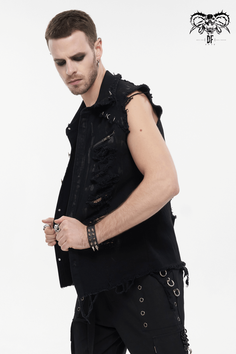 Man in distressed ripped sleeveless punk shirt with metal accents, showcasing edgy style and black fashion.