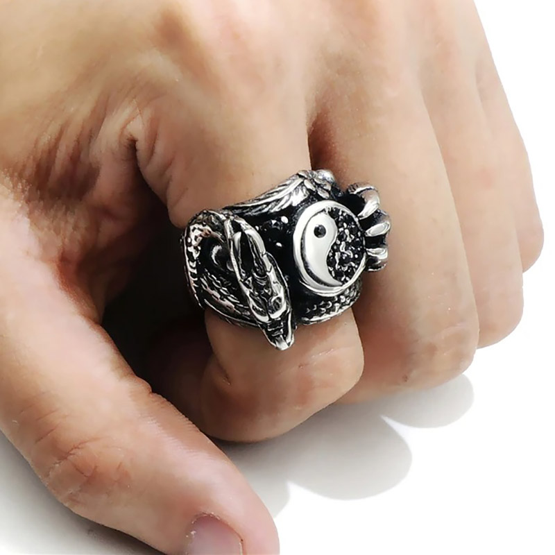 Men's stainless steel dragon claw biker ring worn on hand, featuring a unique design with a yin-yang symbol.