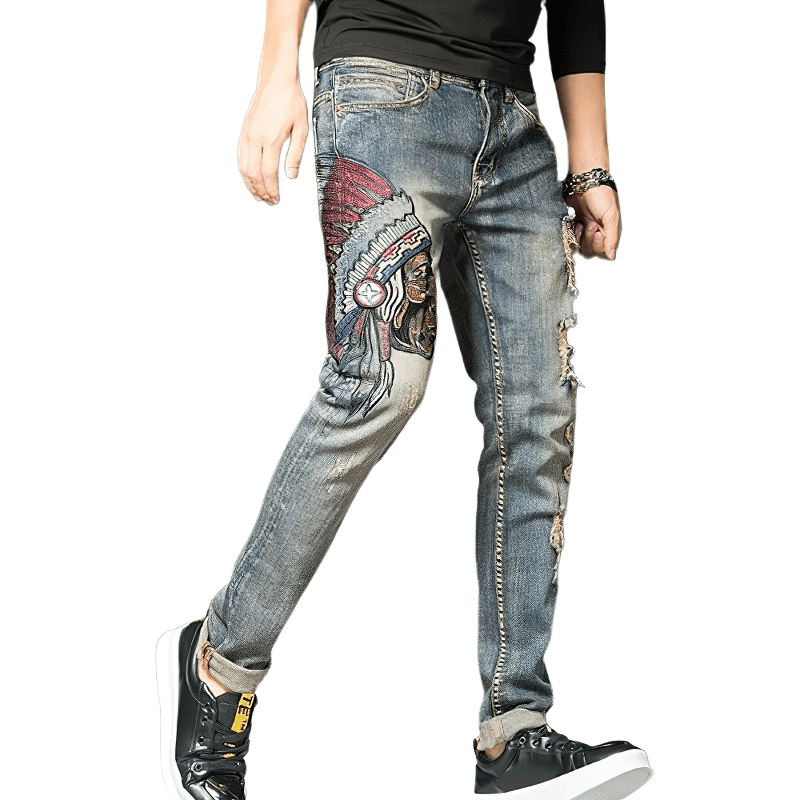 Men's embroidered denim jeans featuring a stylish ripped design and alternative fashion look.