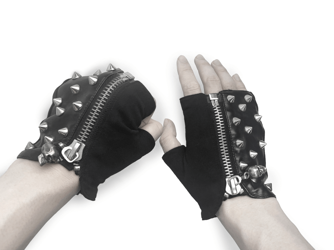 Men's black punk fingerless gloves with silver metal spikes and zippers, perfect for a bold style.