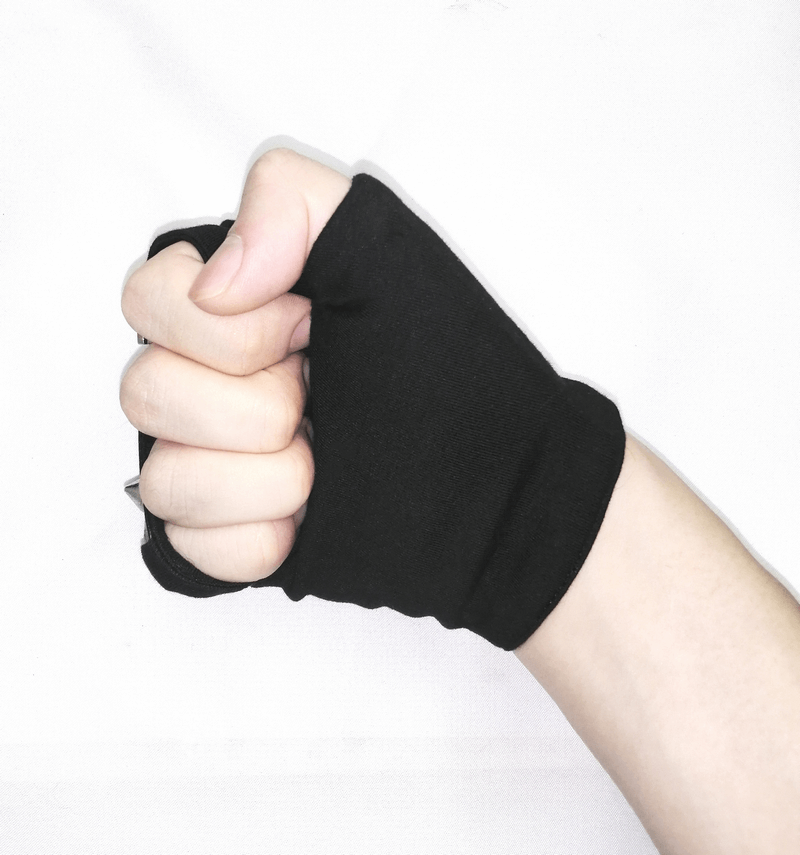 Stylish black fingerless gloves on a hand, perfect for a punk look or motorcycle style accessories.