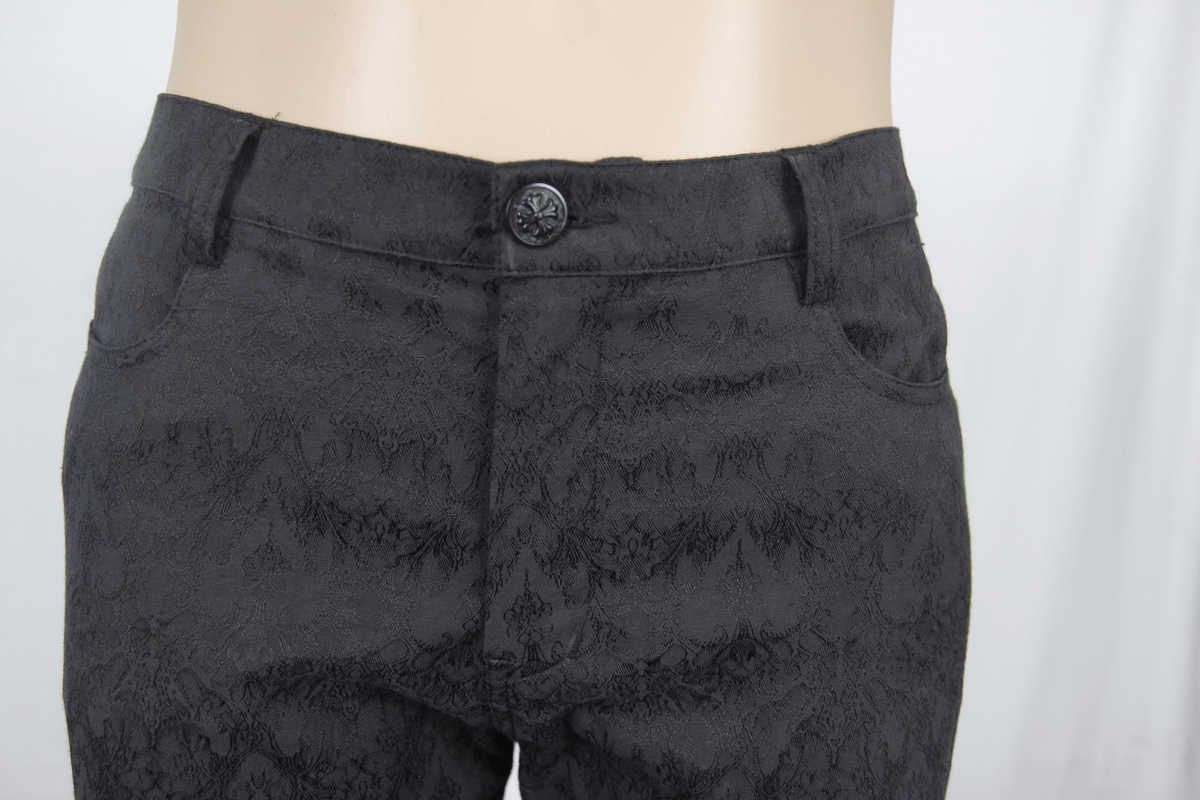 Close-up of gothic black fitted straight trousers for men with elegant design and button detail.
