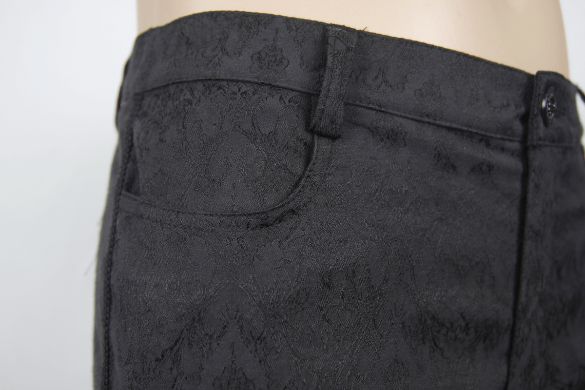 Close-up of gothic black fitted straight trousers with intricate texture and stylish pocket design for men.