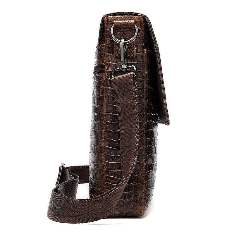 Side view of a stylish brown men's leather bag with crocodile pattern and removable shoulder strap.