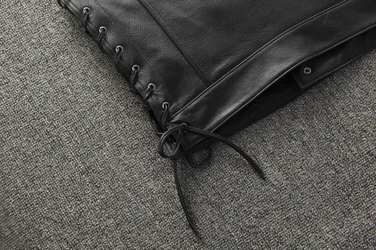 Close-up of the laced side of a male genuine leather motorcycle vest, showcasing its sleek design and adjustable fit.