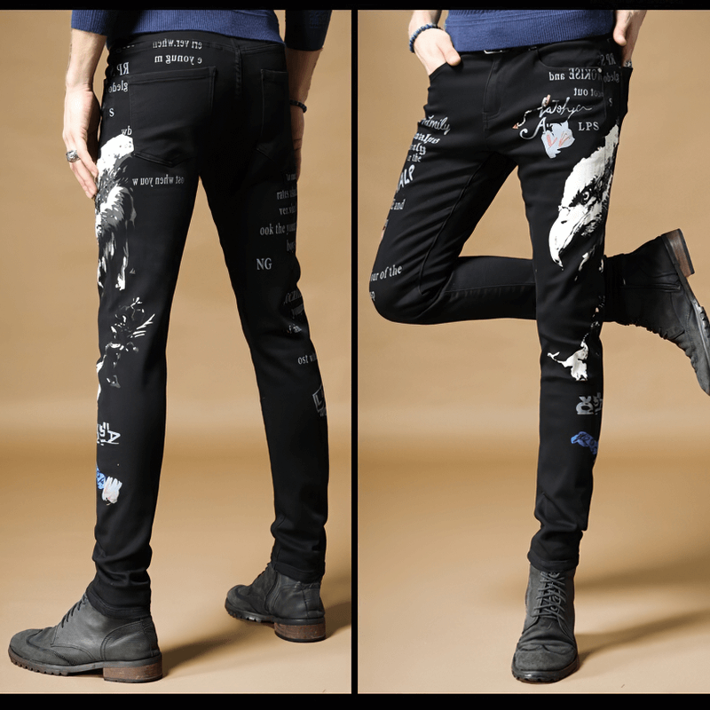 Men's black denim graffiti pants with unique design, perfect for a stylish alternative look.