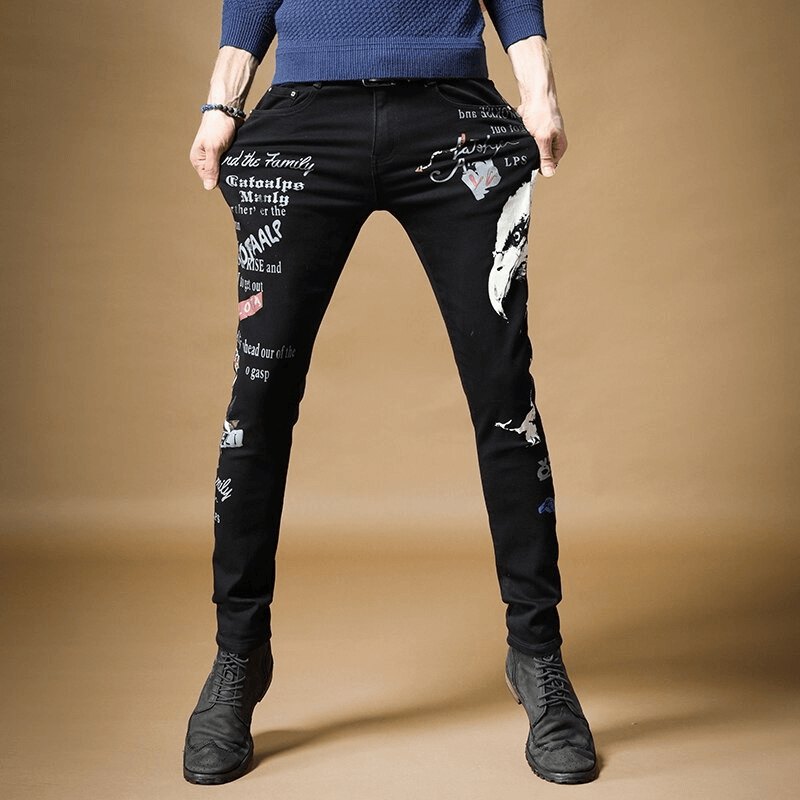 Men's slim black denim pants with graffiti print, perfect for an alternative fashion style.