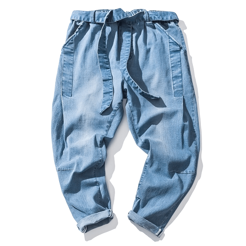 Stylish loose denim pants with belt for men in light blue, perfect for casual wear and comfort.