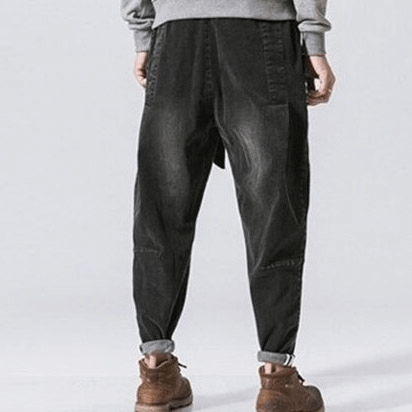 Back view of stylish loose denim pants with belt, perfect for casual wear and comfortable fit.