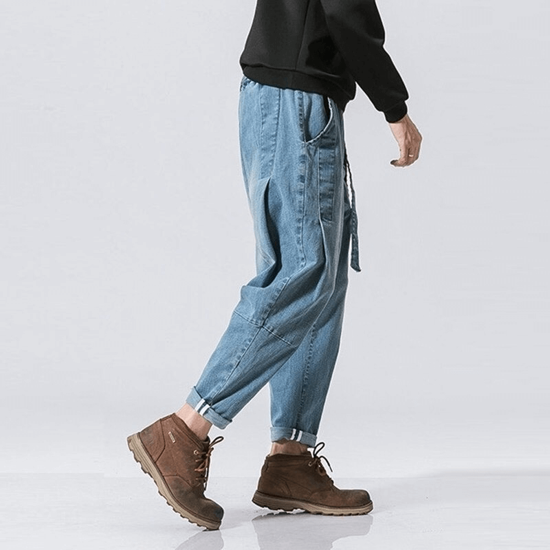 Casual men's loose denim pants with belt, perfect for everyday wear in a trendy light blue color.