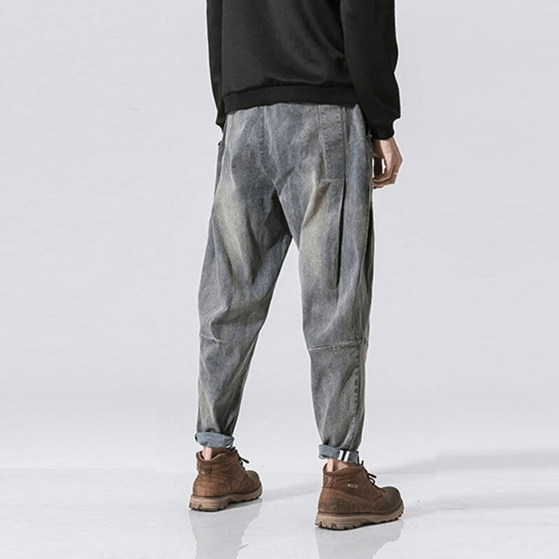 Men's loose denim pants from the back, featuring a casual style and stylish belt for a comfortable look.