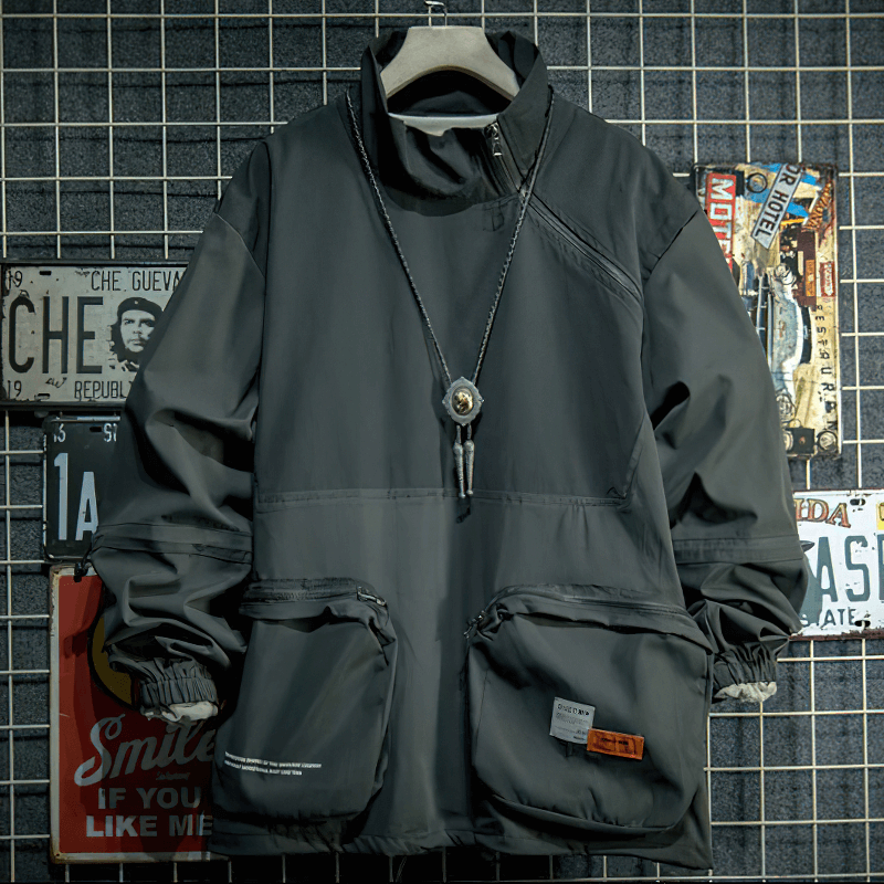 Stylish men's patchwork jacket in black, featuring a stand collar and multiple pockets for a trendy outdoor look.