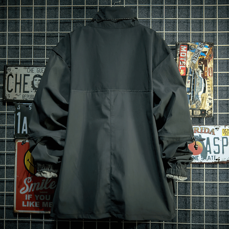 Back view of a stylish men's patchwork loose jacket with multi-pockets, showcasing its casual outdoor design.