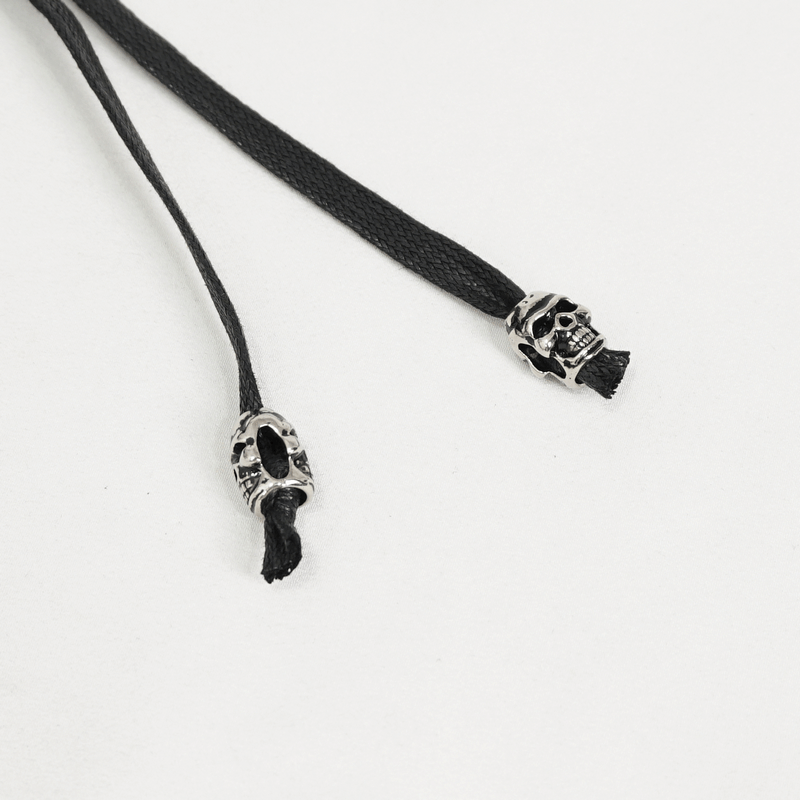 Black cord with skull-shaped metal aglets, perfect for adding punk flair to your alternative style accessories.