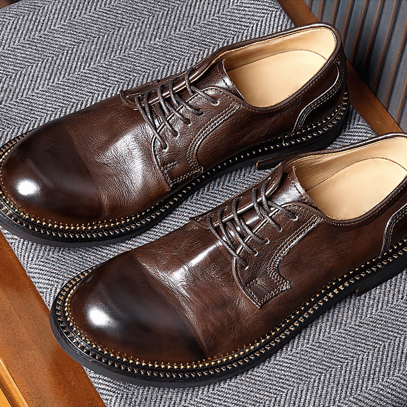 Elegant men's retro leather Oxford shoes in dark brown, showcasing soft material and classic lace-up design.