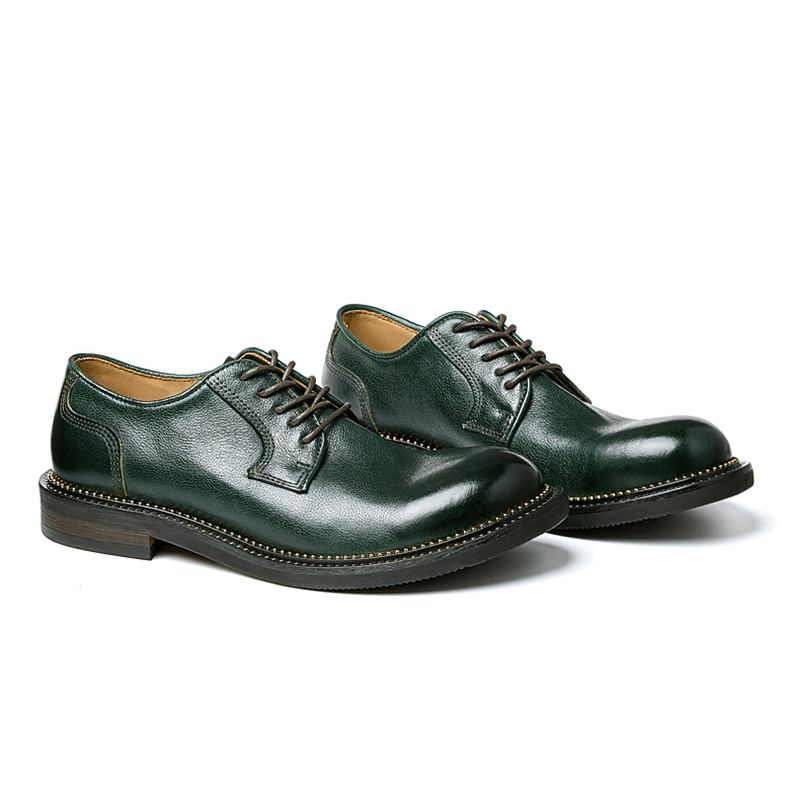 Elegant green leather Oxford shoes with lace-up design, perfect for retro-inspired casual outfits.