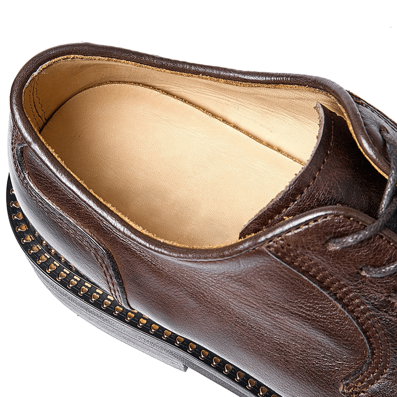 Top view of elegant brown leather Oxford shoe showcasing soft interior and classic lace-up design for casual style.