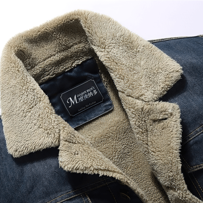 Close-up of male denim jacket collar featuring soft shearling lining for added warmth and comfort.