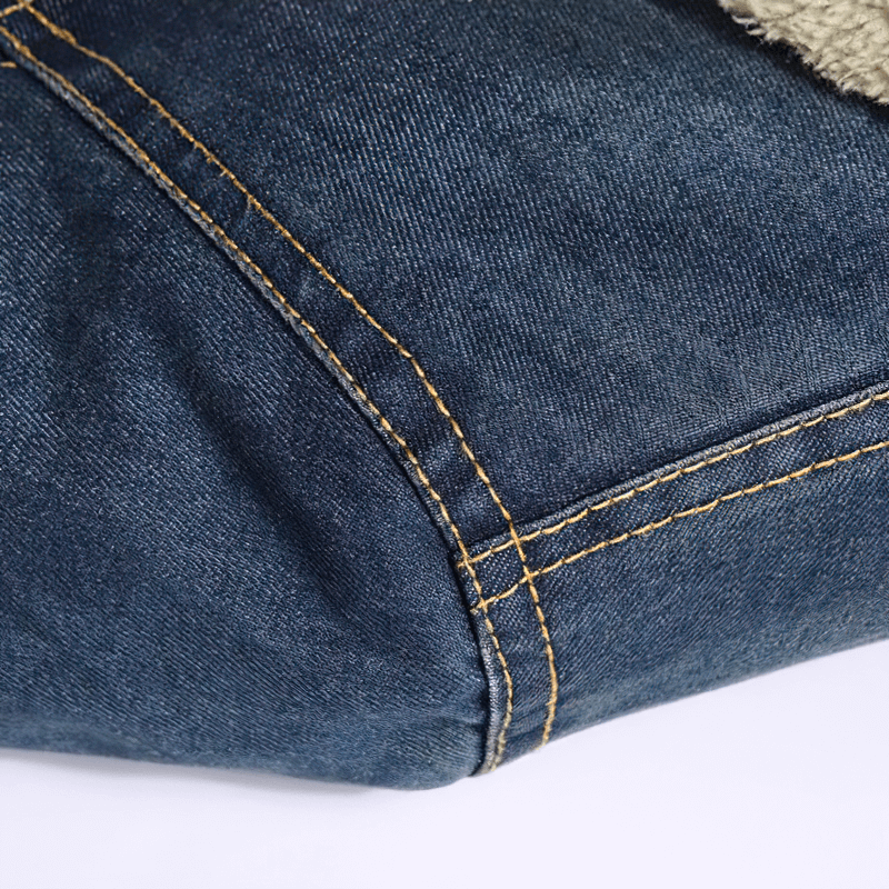 Close-up of a male denim jacket showcasing its stitching and fabric texture for a casual fashion look.