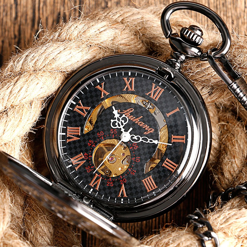 Luxury mechanical pocket watch with flower design and silver fittings, set against rustic rope background.