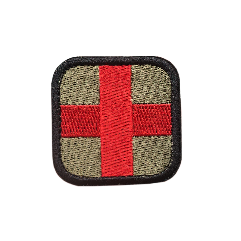 Multicolor medical embroidered patch with red cross on olive background for tactical clothing.