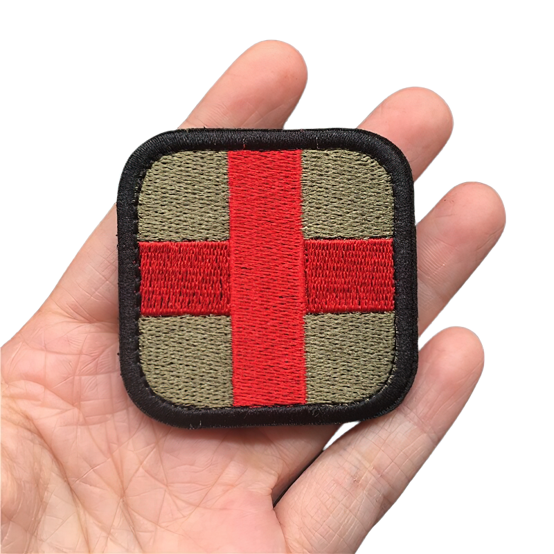 Unisex military embroidered tactical patch featuring a multicolor medical cross design on a hand.