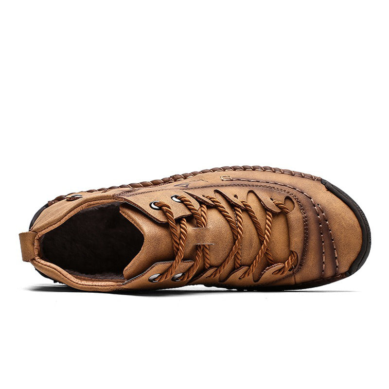 Top view of men's ankle boots in split leather with stylish lace-up design and plush lining for comfort.