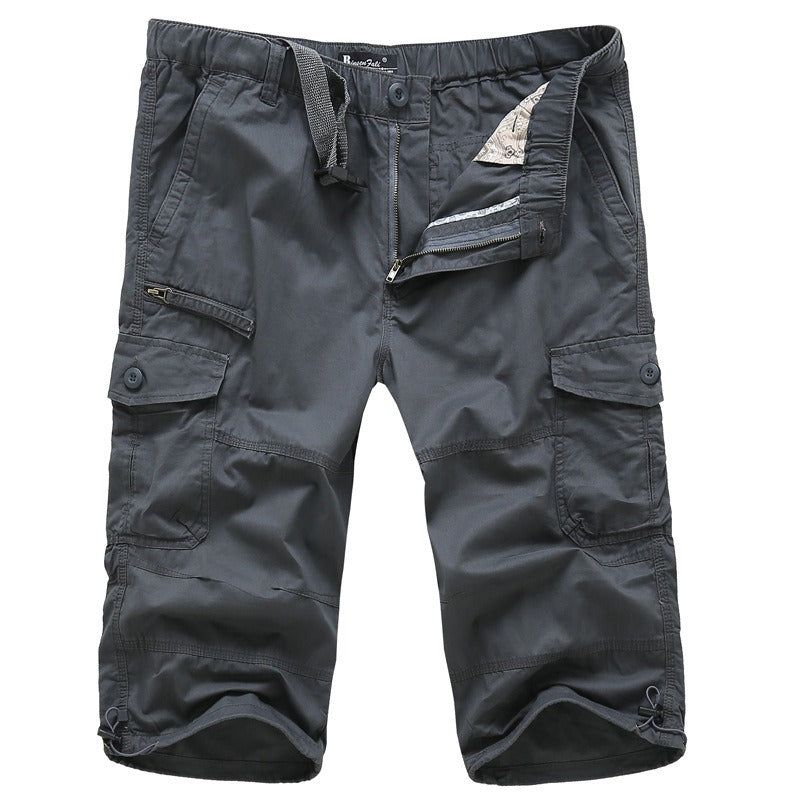 Men's cotton military capri shorts in charcoal gray, featuring multiple pockets and zippers for style and practicality.