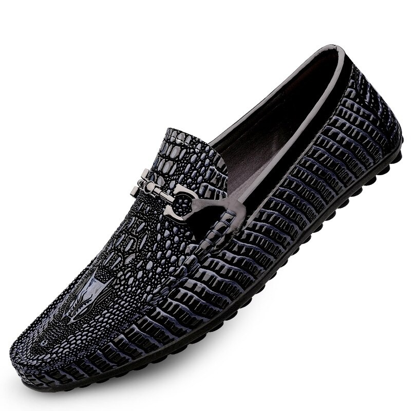 Black leather loafers with croc pattern and rubber sole, perfect for stylish comfort and versatile outfits.