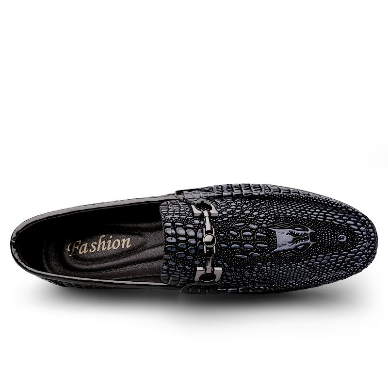 Black gothic men's leather loafers with textured design and stylish buckle accents.