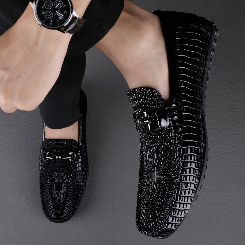 Men's black gothic loafers with a textured design and elegant buckle, perfect for stylish casual outfits.