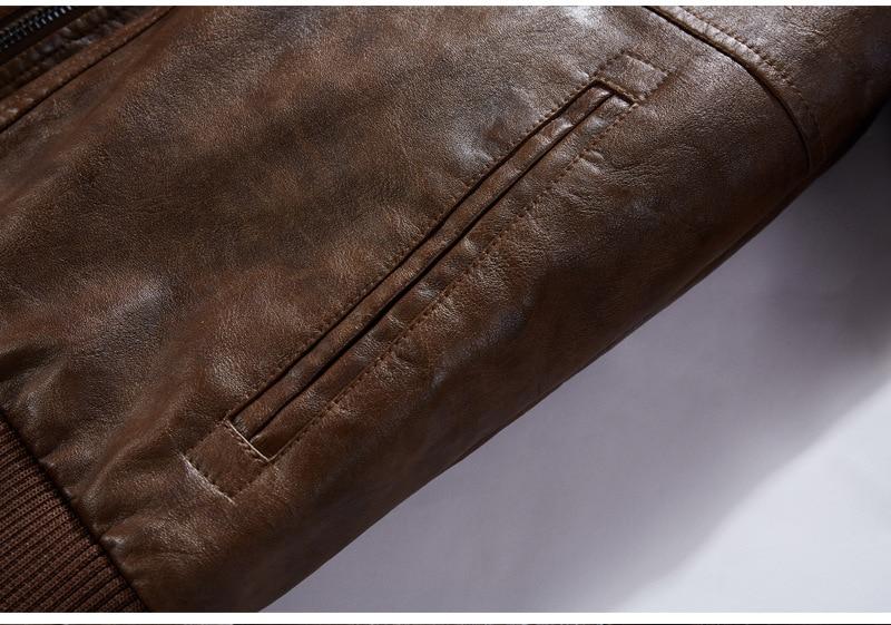 Close-up of brown synthetic leather texture showcasing a pocket on a men's motorcycle hooded jacket.