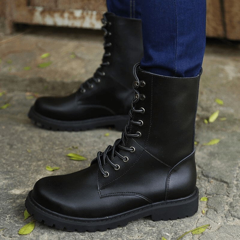 Men's black leather combat boots with lace-up design, perfect for casual wear and stylish outdoor adventures.