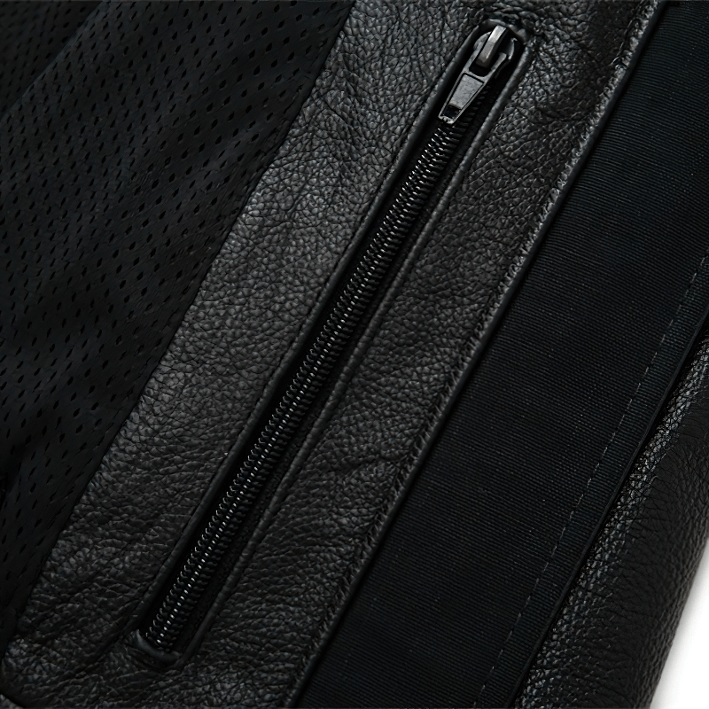 Close-up of men's black genuine leather jacket showcasing quality fabric and zippers for a stylish motorcycle look.