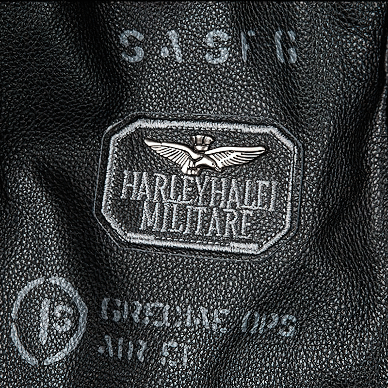 Close-up of Harley-Davidson leather label on motorcycle jacket, showcasing quality craftsmanship and style.