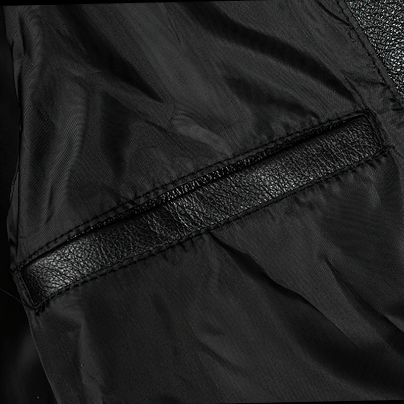Close-up of the sleek pocket design on a men's genuine leather motorcycle jacket.