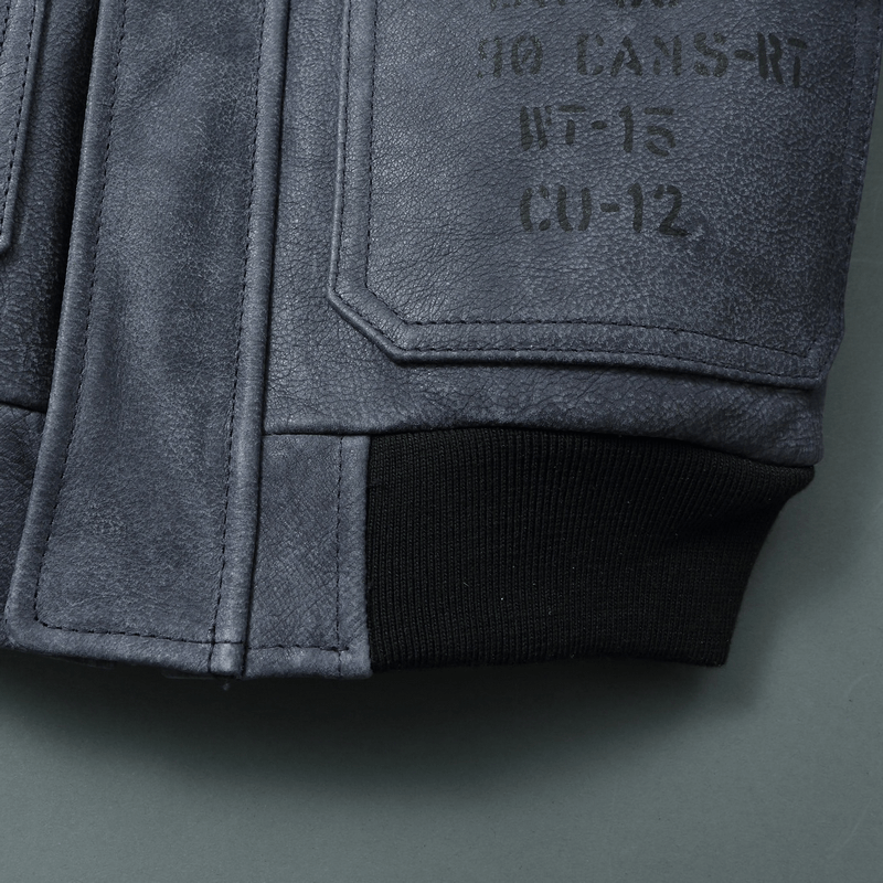 Close-up of men's genuine leather motorcycle jacket showing pocket and cuff details, perfect for stylish riding.